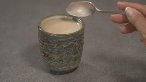 Side view - chef pouring sugar in a Japanese tea cup 4k. Video stock 96142229