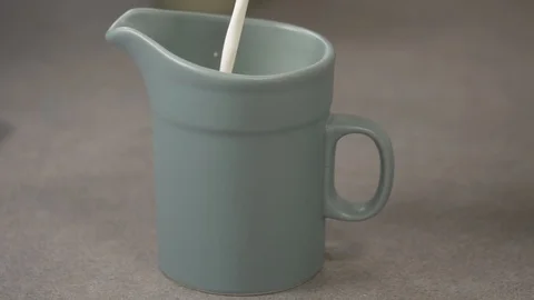 Side view-chef pouring whipped cream in a green jar 4k 動画素材 96140773