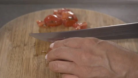 Side View-Chef slicing Italian tomatoes to make pasta sauce 4k Stockbeeldmateriaal 96154050