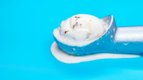 Side view chestnut and red bean ice cream ball melting timelapse on a spoon Stock Footage 107588863