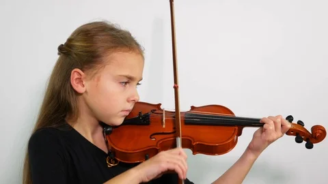 Side view child playing violin, studio shot Stock Footage 101120123