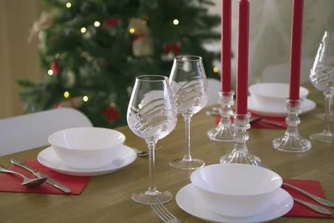 Side view of the Christmas setting of the festive table. Beautiful white kitc Stock Photos