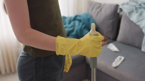 Side View of Cleaner in Yellow Gloves Holding Mop Handle Vidéo 319908547