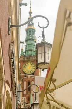 Side view of clock tower in Gdansk from nearest cafe Stock Photos