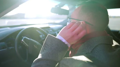 Side view close-up of Caucasian man putting on coronavirus face mask sitting on Video stock 148764876