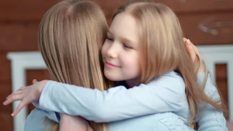 Side view close-up cute baby girl enjoying hugging with mother at home Stock-Footage 103333771