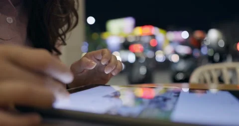 Side view, close up of a female hand using digital tablet .Lifestyle and tech Stock Footage 233596169