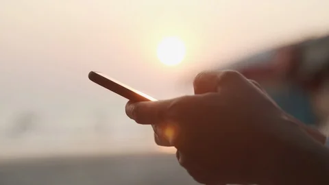Side view. Close up  Hand of young women using smart phone  on the beach Stock Footage 122116054