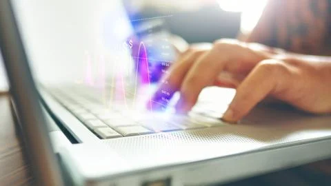 Side view Close up of man hands typing on laptop in office with hologram and Stock Photos