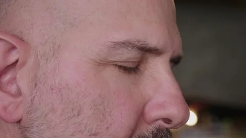 Side view close-up of middle-aged man's eyes lifting with realization Stock Footage 278166824