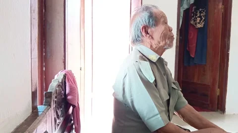 Side-view close-up of a smiling Indonesian elderly man. Stock Footage 318771545