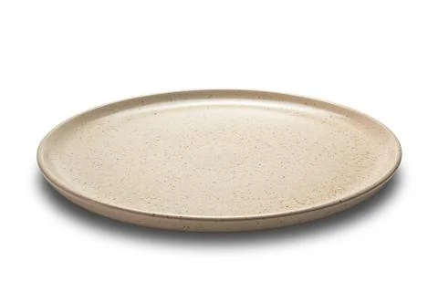 Side view closeup of brown ceramic plate isolated on white background. Stock Photos