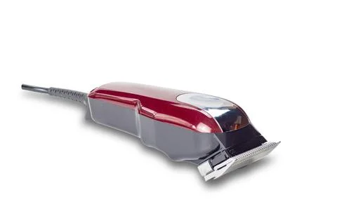 Side view closeup of professional single red corded electric hairclipper. Stock Photos