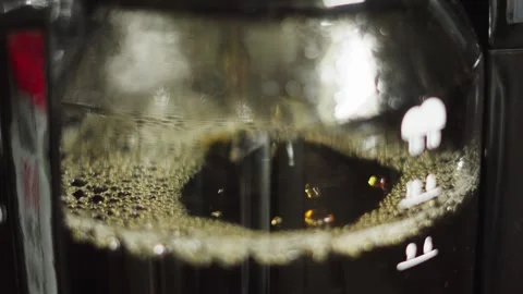 Side View of Coffee Dripping into Jug in Morning as Hot Water Passes Through Stock Footage 311457766