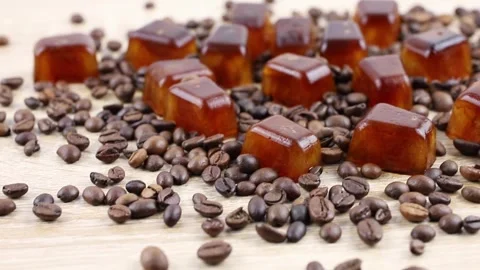 Side view of coffee ice cuber scattered on table. Stock-Footage 312512612
