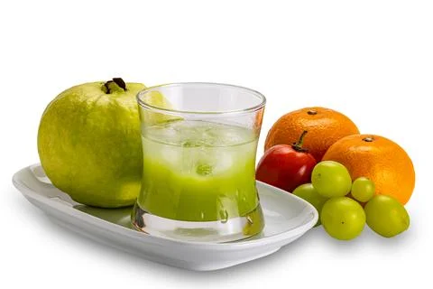 Side view of cold fresh guava juice in transparent glass. Stock Photos
