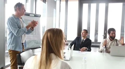 Side view of colleagues clapping on a meeting Stock Footage 59544083