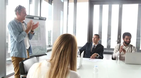 Side view of colleagues clapping to young businessman on a meeting Stock Footage 59544085