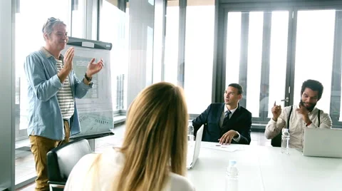 Side view of colleagues clapping to young businessman on a meeting Stock Footage 59544090