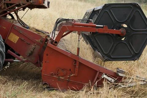 A side view of a combine harvester's header mechanism. Stock Photos