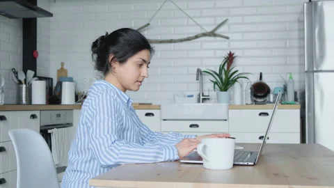 Side view concentrated young indian businesswoman working on computer at office Stock Footage 134940300
