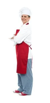 Side view of confident middle aged female chef Stock Photos