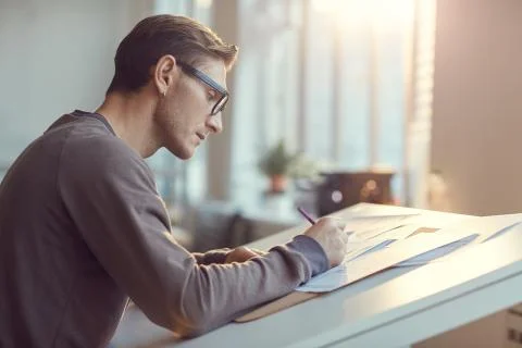 Side View of Contemporary Engineer Drawing Plans Stock Photos