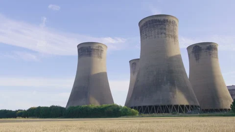 Side View Of Cooling Towers In Field Stock Footage 242515937