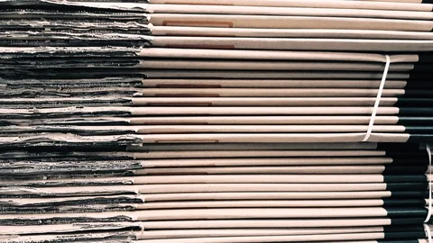 Side view of a corrugated cardboard pile in a factory Stock Footage 104489167