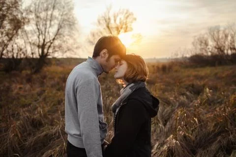 Side view of couple in field Stock Photos