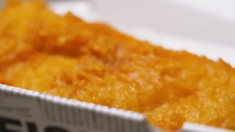 Side View of Crispy Delicious Battered Fish in Takeaway Box Ready to Eat. Stock Footage 321894667