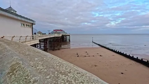 Side on view of Cromer pier, Norfolk Coast Stock-Footage 322976192