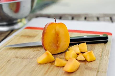 Side View of a Cut Open Amigo Pluot with Chopped Pieces Stock Photos