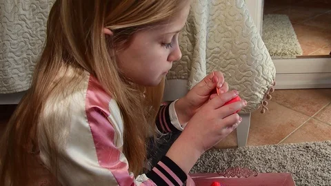 Side view of cute pensive blonde caucasian girl making plasticine craft Stock Footage 127702329