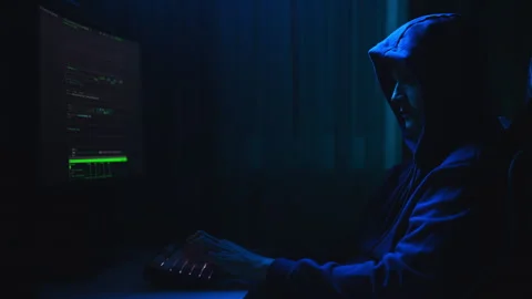 Side view of dangerous hacker male wearing sweatshirt with hood breaking into Stock Footage 276504727