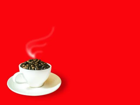 Side view, dark brown coffee beans in white coffee cup and saucer 스톡 사진