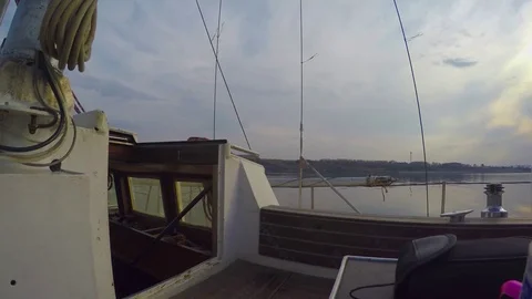 Side view from deck white steel yachts at the spring coast Stock Footage 75611394