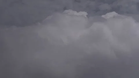 Side view of dense white clouds from an airplane window Stock-Footage 253992708