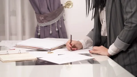 A side view of designer's hands drawing a sketch with a pencil. Stock Footage 100330267