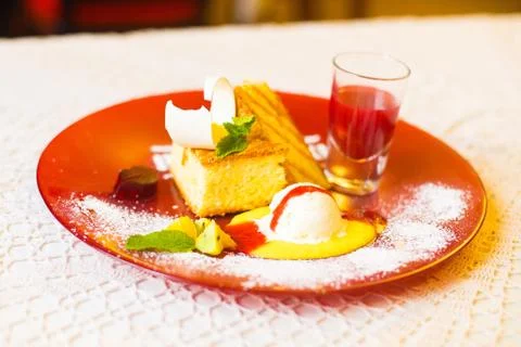 The side view of the dessert consisted of the pineapple, cakes, mint, jelly and Stock Photos