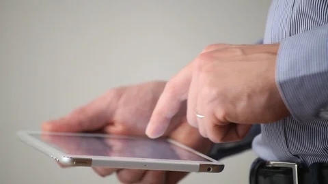 Side view of digital tablet computer in hands, typing closeup Video stock 98100071