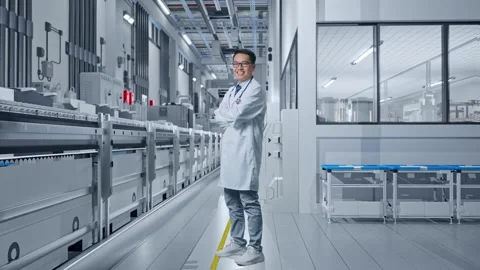 Side View Of Doctor Crossing His Arms And Smiling in Medical Factory Stock Footage 314119131