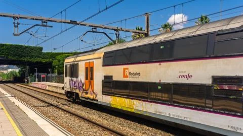 Side view of a double-decker passenger train Photos