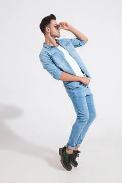 Side view of a dramatic casual man dancing Stock Photos