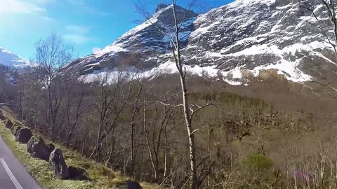 Side view of driving rural road in Norway 動画素材 90482901
