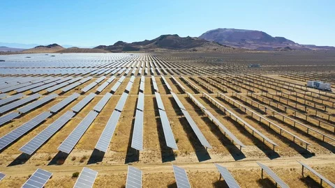 Side view drone aerial of vast solar array in Mojave Desert, California, Stock Footage 120396001