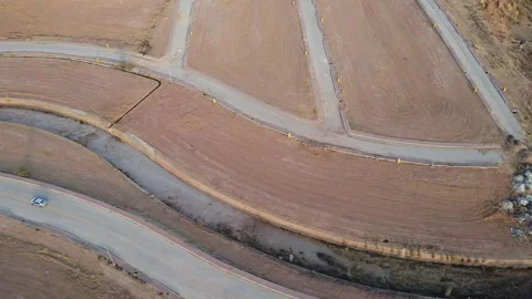 Side-view drone shot of empty plots, showing property boundaries, Stock Footage 302154029