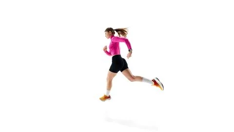 Side view dynamic image of young competitive woman, runner in motion Stock Photos