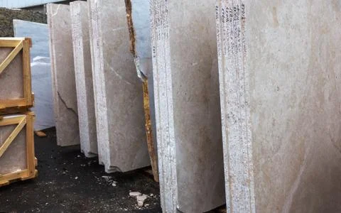 Side view of the edge of the granite slab in bulk. A stack of granite slabs - Stock Photos
