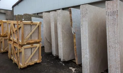 Side view of the edge of the granite slab in bulk. A stack of granite slabs - Stock Photos